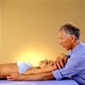 Harvey Burns performing a Rolfing session on a client.