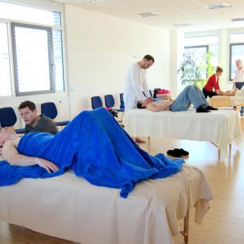 Harvey Burns in class demonstrating a Rolfing technique to students